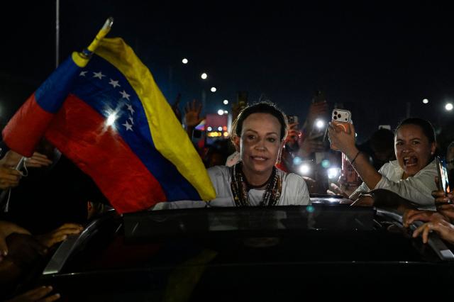 Venezuelan opposition leader and Nobel Peace Prize laureate Maria Corina Machado poses for a photo after her arrival in Caracas on October 25, 2026. Machado returned to her home country on October 25, 2026, after almost a year in exile, greeting ecstatic supporters at a church in the city of Barquisimeto. (Photo by Federico PARRA / AFP)