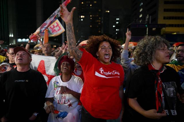 Supporters of Brazil's President and presidential candidate Luiz Inacio Lula da Silva celebrate after the results of the presidential runoff election in Rio de Janeiro, Brazil on October 25, 2026. Lula da Silva pulled off a dramatic comeback on October 25, 2026, as he clinched election victory against right-wing senator Flavio Bolsonaro, who trounced him in the first round. (Photo by Juan BARRETO / AFP)