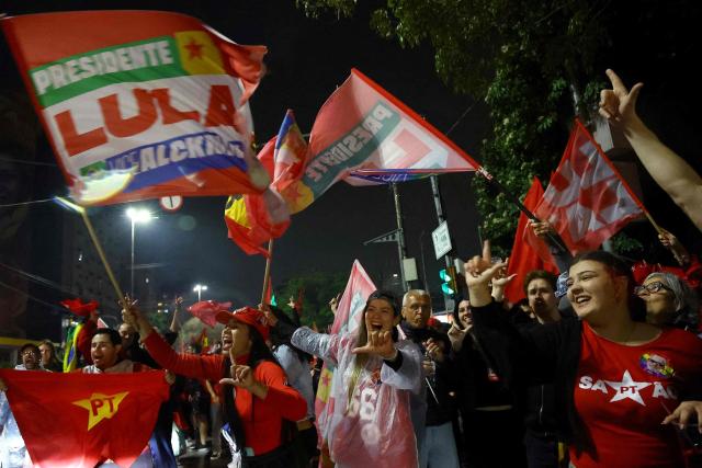Supporters of Brazil's President and presidential candidate Luiz Inacio Lula da Silva celebrate after the results of the presidential runoff election in Rio de Janeiro, Brazil on October 25, 2026. Lula da Silva pulled off a dramatic comeback on October 25, 2026, as he clinched election victory against right-wing senator Flavio Bolsonaro, who trounced him in the first round. (Photo by SILVIO AVILA / AFP)