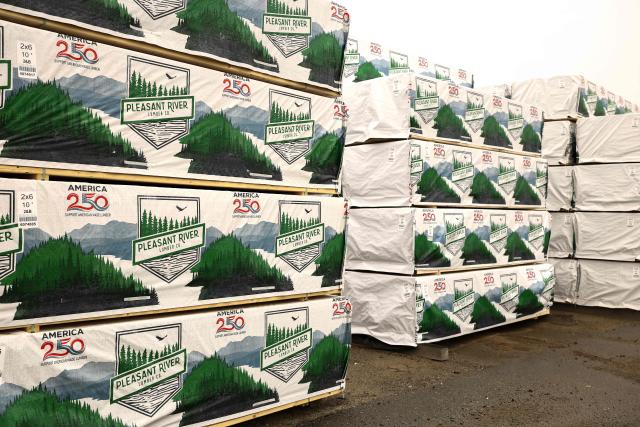 Loads of softwood lumber are ready to be shipped at the "Pleasant River Lumber" sawmill in Enfield, Maine, on October 13, 2026. In the heat of US midterm elections, President Donald Trump's tariffs on Canada, and Ottawa's retaliation, have taken center stage in timber-producing Maine, walloped by the economic fallout perhaps more than any other state. Residents in Maine's frontier towns express worry that the tariffs have also triggered a rupture in cross-border relationships built up over decades, and that the intricate community fabric could take years to repair. (Photo by CHARLY TRIBALLEAU / AFP)