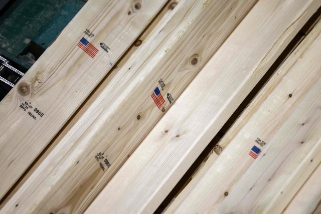Softwood lumber is being processed at the "Pleasant River Lumber" sawmill in Enfield, Maine, on October 13, 2026. In the heat of US midterm elections, President Donald Trump's tariffs on Canada, and Ottawa's retaliation, have taken center stage in timber-producing Maine, walloped by the economic fallout perhaps more than any other state. Residents in Maine's frontier towns express worry that the tariffs have also triggered a rupture in cross-border relationships built up over decades, and that the intricate community fabric could take years to repair. (Photo by CHARLY TRIBALLEAU / AFP)