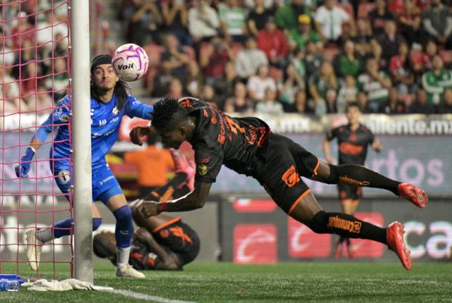 Tijuana's Ecuadorian forward #07 Adonis Preciado dives for the ball during the Liga MX Apertura tournament football match between Tijuana and Santos Laguna at the Caliente satdium, in Tijuana, Baja California, Mexico on October 25, 2026. (Photo by Guillermo Arias / AFP)
