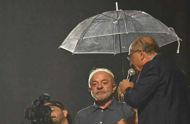 Brazil's President and presidential candidate Luiz Inacio Lula da Silva listens to his  Vice President Geraldo Alckmin after winning the presidential runoff election in Sao Paulo, Brazil, on October 25, 2026. Lula da Silva pulled off a dramatic comeback on October 25, 2026, as he clinched election victory against right-wing senator Flavio Bolsonaro, who trounced him in the first round. (Photo by Juan BARRETO / AFP)