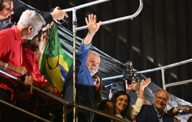 Brazil's President and presidential candidate Luiz Inacio Lula da Silva gestures to supporters after winning the presidential runoff election in Sao Paulo, Brazil, on October 26, 2026. Lula da Silva pulled off a dramatic comeback on October 25, 2026, as he clinched election victory against right-wing senator Flavio Bolsonaro, who trounced him in the first round. (Photo by Juan BARRETO / AFP)