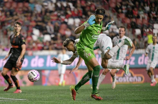 Tijuana's goalkeeper #02 Antonio Rodriguez and Santos' Paraguayan forward #07 Diego Gonzalez fight for the ball during the Liga MX Apertura tournament football match between Tijuana and Santos Laguna at the Caliente satdium, in Tijuana, Baja California, Mexico on October 25, 2026. (Photo by Guillermo Arias / AFP)