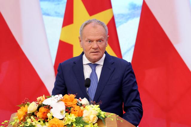 Poland's Prime Minister Donald Tusk attends a press briefing with Vietnam's Prime Minister Le Minh Hung at the Government Office in Hanoi on October 26, 2026. (Photo by Quang Nguyen / AFP)