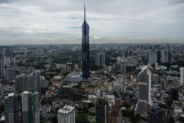 The Warisan Merdeka Tower (KL118) and surrounding commercial buildings are seen through clear skies as haze conditions due to Indonesian wildfires improve in Kuala Lumpur on October 26, 2026. The haze has sent air pollution levels surging to dangerous levels not only in Indonesia, but also in Malaysia, Singapore and East Timor, prompting the ASEAN regional bloc to call a meeting over the crisis. (Photo by Mohd Rasfan / AFP)