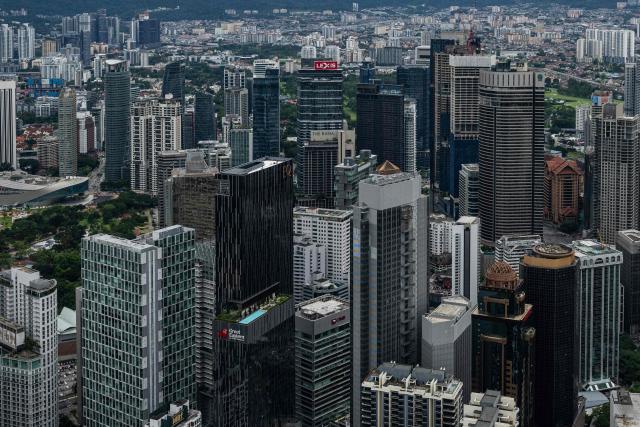Commercial buildings are seen through clear skies as haze conditions due to Indonesian wildfires improve in Kuala Lumpur on October 26, 2026. The haze has sent air pollution levels surging to dangerous levels not only in Indonesia, but also in Malaysia, Singapore and East Timor, prompting the ASEAN regional bloc to call a meeting over the crisis. (Photo by Mohd RASFAN / AFP)