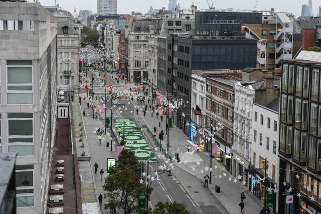 This general overhead view shows a section of one of Britain's most famous shopping streets, Oxford Street, as it goes permanently traffic-free for the first time in central London on October 26, 2026. (Photo by CARLOS JASSO / AFP)