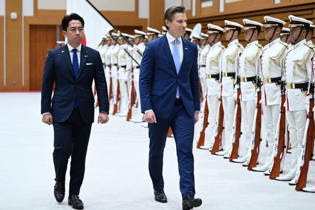 Finland's Defence Minister Antti Hakkanen (R) inspects an honour guard with Japan's Defence Minister Shinjiro Koizumi before their meeting at the Ministry of Defence in Tokyo on October 26, 2026. (Photo by Rie KIKUCHI / AFP)