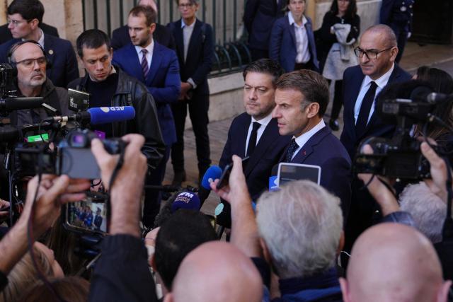 EDITORS NOTE: Graphic content / France's President Emmanuel Macron (C-R) and the mayor of Marseille Benoit Payan (C-L), next to France's Interior Minister Laurent Nunez (R), address media in Marseille, southern France on October 26, 2026, during a visit to notice the 'return of republican order' after the violence and looting that punctuated the citizen mobilization of October 17, 2026. Protests by high school students over learning conditions sparked a movement that has since spread nationwide, fuelled by broader anger over the rising cost of living. (Photo by Aurelien Morissard / POOL / AFP)