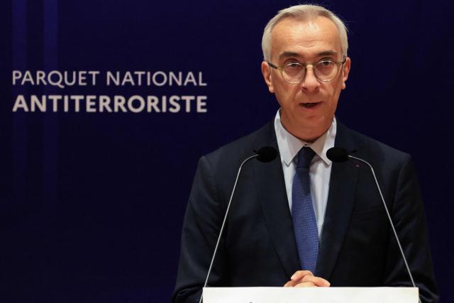 France's counter-terrorism public prosecutor Olivier Christen speaks during a press conference at the Paris Judicial Court, in Paris on October 26, 2026, following the terrorist attack that took place on October 23 in Trappes and La Verriere. French authorities have transferred to a psychiatric unit a man suspected of a gun attack in the Paris suburbs that killed one person and wounded five, prosecutors said on October 25, 2026. The man was detained on October 23 with a machine gun and tear-gas grenades in his car, shortly after the victims were shot as a vehicle drove through the towns of Trappes and La Verriere, west of Paris. (Photo by Ludovic MARIN / AFP)