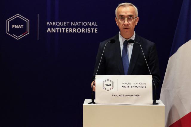 France's counter-terrorism public prosecutor Olivier Christen speaks during a press conference at the Paris Judicial Court, in Paris on October 26, 2026, following the terrorist attack that took place on October 23 in Trappes and La Verriere. French authorities have transferred to a psychiatric unit a man suspected of a gun attack in the Paris suburbs that killed one person and wounded five, prosecutors said on October 25, 2026. The man was detained on October 23 with a machine gun and tear-gas grenades in his car, shortly after the victims were shot as a vehicle drove through the towns of Trappes and La Verriere, west of Paris. (Photo by Ludovic MARIN / AFP)