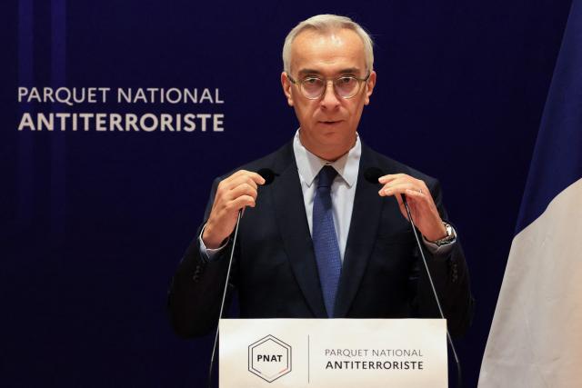 France's counter-terrorism public prosecutor Olivier Christen speaks during a press conference at the Paris Judicial Court, in Paris on October 26, 2026, following the terrorist attack that took place on October 23 in Trappes and La Verriere. French authorities have transferred to a psychiatric unit a man suspected of a gun attack in the Paris suburbs that killed one person and wounded five, prosecutors said on October 25, 2026. The man was detained on October 23 with a machine gun and tear-gas grenades in his car, shortly after the victims were shot as a vehicle drove through the towns of Trappes and La Verriere, west of Paris. (Photo by Ludovic MARIN / AFP)