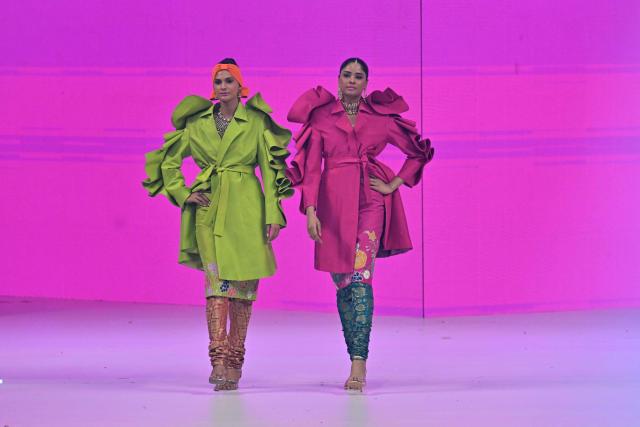 Models present creations by fashion designer Ail Xeeshan during the LAAM Fashion Week in Lahore on October 26, 2026. (Photo by Arif ALI / AFP)