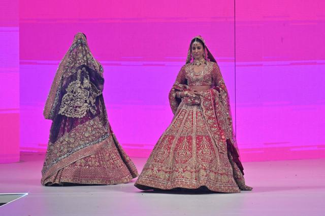 Models present creations by fashion designer Ail Xeeshan during the LAAM Fashion Week in Lahore on October 26, 2026. (Photo by Arif ALI / AFP)