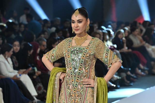 A model presents a creation by fashion designer Haris N Tehzeeb during the LAAM Fashion Week in Lahore on October 26, 2026. (Photo by Arif ALI / AFP)
