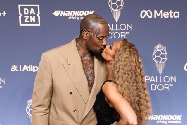 Broadcaster Kate Scott and husband Malik Scott pose upon arrival to attend the 2026 Ballon d'Or France Football award ceremony at the Palladium Theatre in London on October 26, 2026. (Photo by Toby Shepheard / AFP)