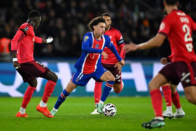 PSG's French forward #11 Maghnes Akliouche runs with the ball during the French L1 football match between Paris Saint-Germain (PSG) and Olympique Lyonnais (OL) at the Parc des Princes stadium in Paris on October 26, 2026. (Photo by JULIEN DE ROSA / AFP)