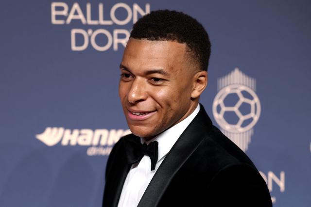 France and Real Madrid forward Kylian Mbappe poses upon their arrival to attend the 2026 Ballon d'Or France Football award ceremony at the Palladium Theatre in London on October 26, 2026. (Photo by Toby Shepheard / AFP)