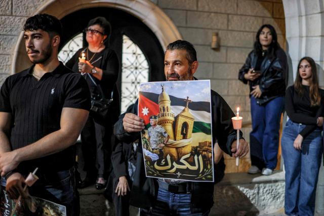 Mourners attend a vigil at the Greek Orthodox Church of the Transfiguration in the Palestinian city of Ramallah in the Israeli-occupied West Bank, on October 26, 2026, in solidarity with the victims of an attack on the Church of St George in Jordan's village of Hammoud on October 23. On October 23, gunmen stormed the compound of the Greek Orthodox St George's Church in the village of Hammoud in Karak governorate during a funeral procession, killing nine. Karak is home to a significant Christian community in Muslim-majority Jordan, where Christians make up between two and three percent of the population. (Photo by Zain JAAFAR / AFP)
