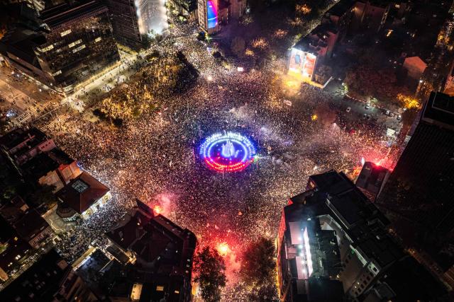 This aerial photograph shows supporters of the Students List gathering at Slavija Square as they celebrate their victory a day after Serbia's snap parliamentary elections, in Belgrade on October 26, 2026. A day after a seismic victory over Serbia's long-serving right-wing leader Aleksandar Vucic, a student-led movement faces the challenge of governing a country beset by problems.
The movement, which mobilised some of Serbia's largest crowds since Slobodan Milosevic fell in 2000, has pledged to tackle corruption, strengthen education and boost the economy.
But on Monday, little was known about the next steps of the student-backed list, made up of experts from various fields, most of them political novices. (Photo by DJORDJE KOSTIC / AFP)