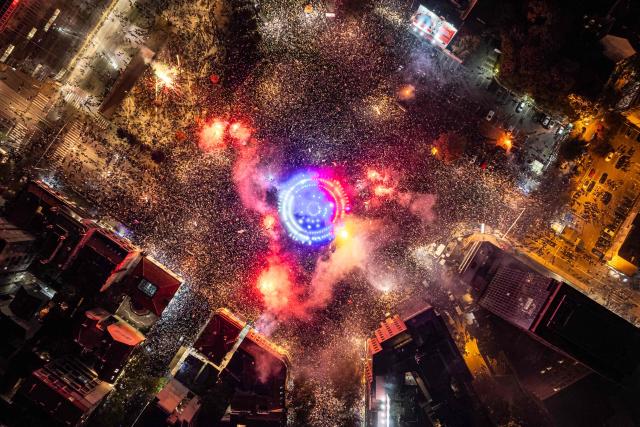 This aerial photograph shows supporters of the Students List gathering at Slavija Square as they celebrate their victory a day after Serbia's snap parliamentary elections, in Belgrade on October 26, 2026. A day after a seismic victory over Serbia's long-serving right-wing leader Aleksandar Vucic, a student-led movement faces the challenge of governing a country beset by problems.
The movement, which mobilised some of Serbia's largest crowds since Slobodan Milosevic fell in 2000, has pledged to tackle corruption, strengthen education and boost the economy.
But on Monday, little was known about the next steps of the student-backed list, made up of experts from various fields, most of them political novices. (Photo by DJORDJE KOSTIC / AFP)