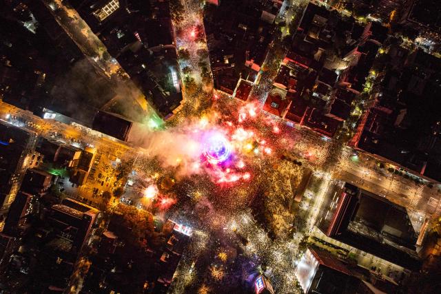 This aerial photograph shows supporters of the Students List gathering at Slavija Square as they celebrate their victory a day after Serbia's snap parliamentary elections, in Belgrade on October 26, 2026. A day after a seismic victory over Serbia's long-serving right-wing leader Aleksandar Vucic, a student-led movement faces the challenge of governing a country beset by problems.
The movement, which mobilised some of Serbia's largest crowds since Slobodan Milosevic fell in 2000, has pledged to tackle corruption, strengthen education and boost the economy.
But on Monday, little was known about the next steps of the student-backed list, made up of experts from various fields, most of them political novices. (Photo by DJORDJE KOSTIC / AFP)
