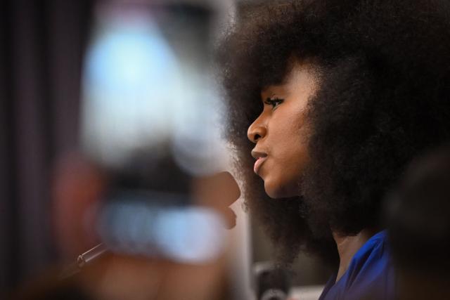 French anti-racist activist Assa Traore addresses a gathering in the town hall of the Paris suburban city of La Courneuve on October 26, 2026, to pay tribute to the victims of the October 23 racist shooting that killed one person and wounded five in Trappes. Marches were held on October 25 in tribute to the man killed in the shooting, Pengo Bossio Wangi, a 26-year-old French national of Congolese origin, and more were planned for today in several French cities, including Paris. (Photo by LOU BENOIST / AFP)