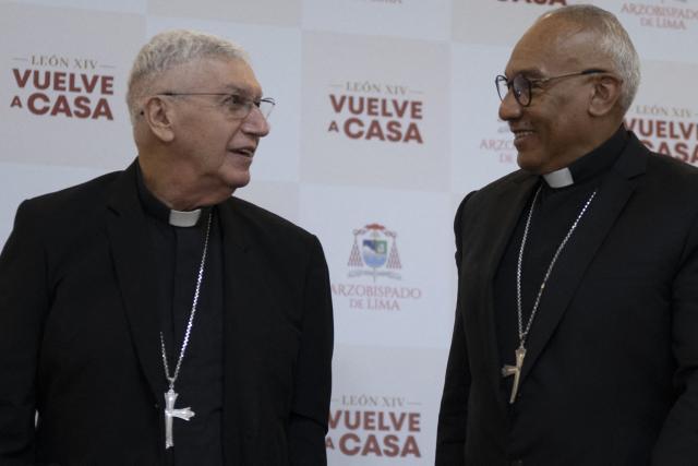 Lima Archbishop Cardinal Carlos Castillo (L) speaks with Lima Auxiliary Bishop Monsignor Guillermo Elias during a press conference in Lima on October 26, 2026, to provide information on ticket registration and access procedures for the mass to be celebrated by Pope Leo XIV at Las Palmas Air Base on November 16, 2026. (Photo by ERNESTO BENAVIDES / AFP)