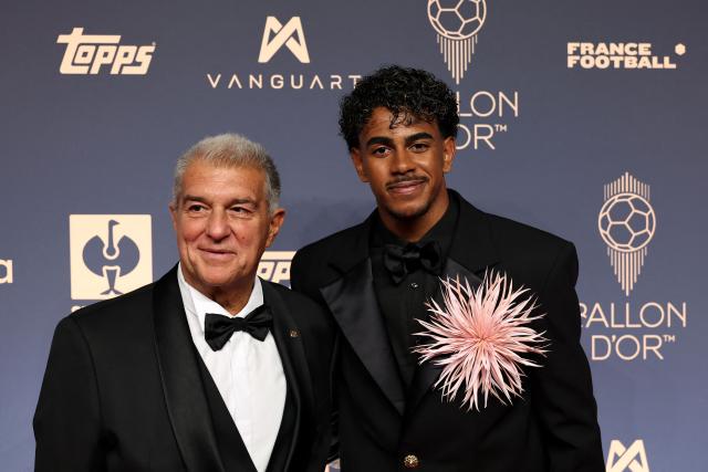 President of FC Barcelona Joan Laporta and Spain's forward Lamine Yamal pose upon their arrival to attend the 2026 Ballon d'Or France Football award ceremony at the Palladium Theatre in London on October 26, 2026. (Photo by FRANCK FIFE / AFP)