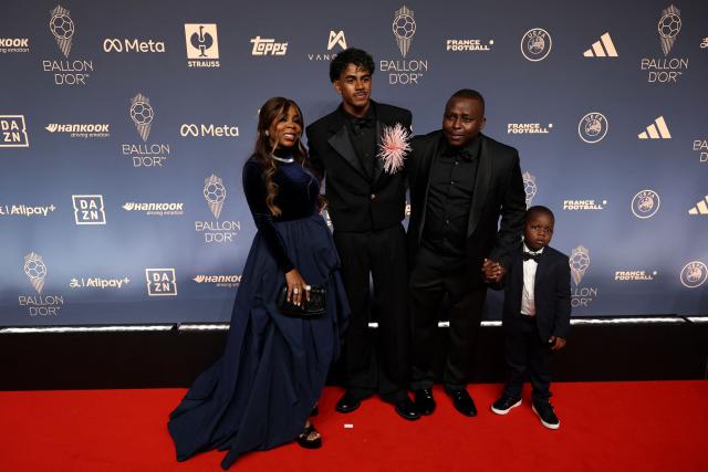 Spain and Barcelona forward Lamine Yamal (C) and his mother Sheila Ebana (L) pose upon their arrival to attend the 2026 Ballon d'Or France Football award ceremony at the Palladium Theatre in London on October 26, 2026. (Photo by FRANCK FIFE / AFP)