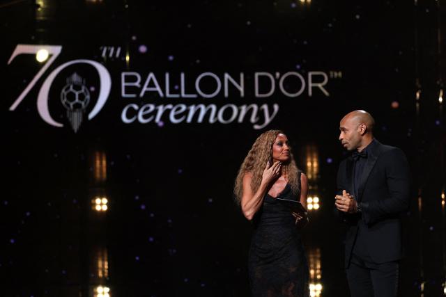 Hosts Kate Scott and Thierry Henry on stage during the 2026 Ballon d'Or France Football award ceremony at the Palladium Theatre in London on October 26, 2026. (Photo by FRANCK FIFE / AFP)