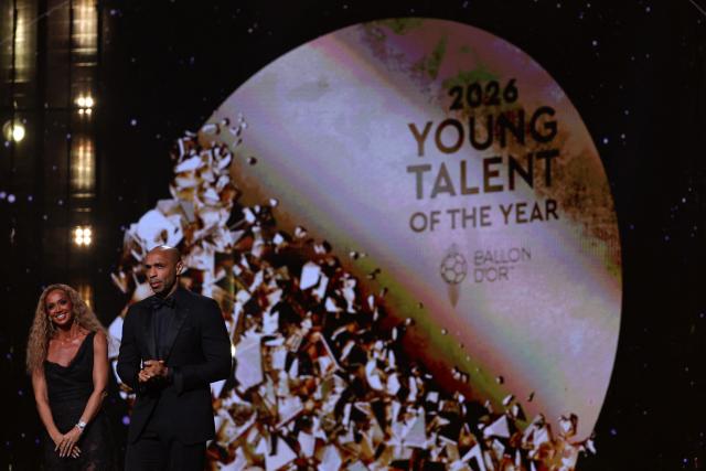 Hosts Kate Scott and Thierry Henry present the Young Talent Awards on stage during the 2026 Ballon d'Or France Football award ceremony at the Palladium Theatre in London on October 26, 2026. (Photo by FRANCK FIFE / AFP)