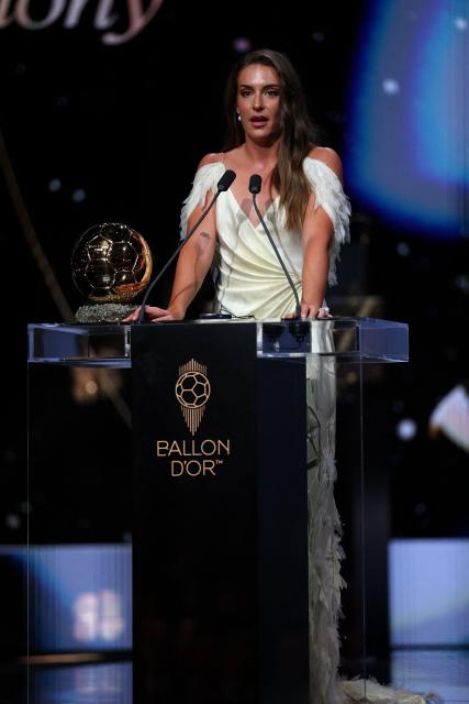 Spain and Barcelona midfielder Alexia Putellas delivers a speech after receiving the Ballon d'Or Feminin award for the best female footballer during the 2026 Ballon d'Or France Football award ceremony at the Palladium Theatre in London on October 26, 2026. (Photo by FRANCK FIFE / AFP)