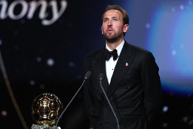 England and Bayern Munich forward Harry Kane reacts after receiving the Ballon d'Or award for the best male footballer during the 2026 Ballon d'Or France Football award ceremony at the Palladium Theatre in London on October 26, 2026. (Photo by FRANCK FIFE / AFP)