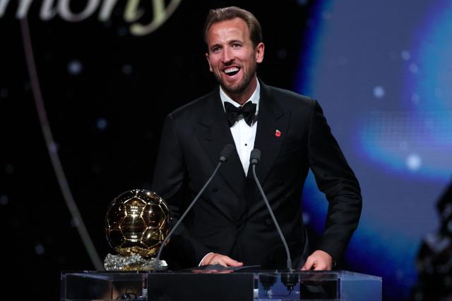 England and Bayern Munich forward Harry Kane reacts after receiving the Ballon d'Or award for the best male footballer during the 2026 Ballon d'Or France Football award ceremony at the Palladium Theatre in London on October 26, 2026. (Photo by FRANCK FIFE / AFP)