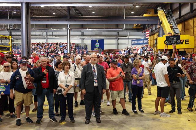 Supporters look on as they wait for US Vice President JD Vance to speak at a campaign rally at HME, Inc. in Topeka, Kansas on October 26, 2026. Vance is campaigning for US Senator Roger Marshall (R-KS). (Photo by Finn Gomez / POOL / AFP)