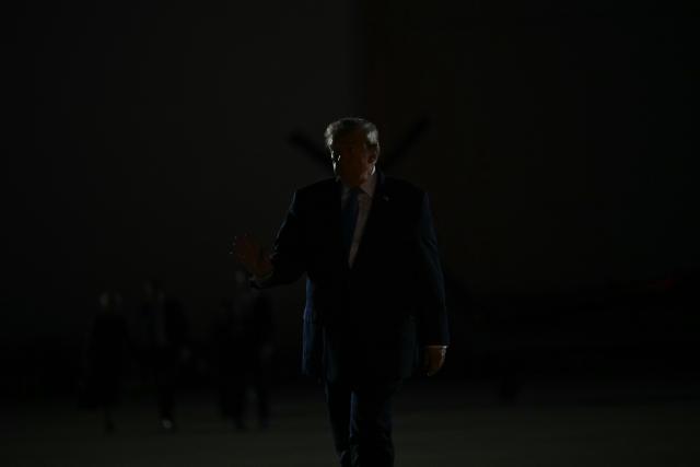 US President Donald Trump walks to board Air Force One at Frederick W. Smith International Airport in Memphis, Tennessee on October 26, 2026. President Trump is returning to Washington, DC after speaking at a midterm campaign rally in Mississippi. (Photo by Kent NISHIMURA / AFP)