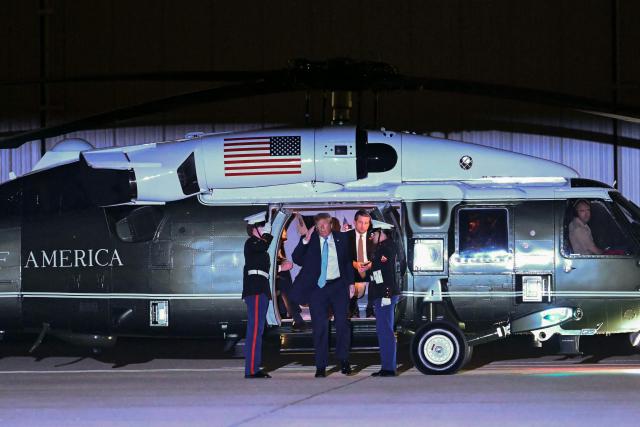US President Donald Trump disembarks from Marine One and walks to board Air Force One at Frederick W. Smith International Airport in Memphis, Tennessee on October 26, 2026. President Trump is returning to Washington, DC after speaking at a midterm campaign rally in Mississippi. (Photo by Kent NISHIMURA / AFP)