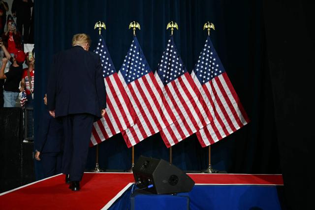 US President Donald Trump walks off stage at a midterm campaign rally at Crossroads Arena in Corinth, Mississippi on October 26, 2026. President Trump is holding the campaign rally to support the re-election campaign of US Senator Cindy Hyde-Smith (R-MS). (Photo by Kent NISHIMURA / AFP)
