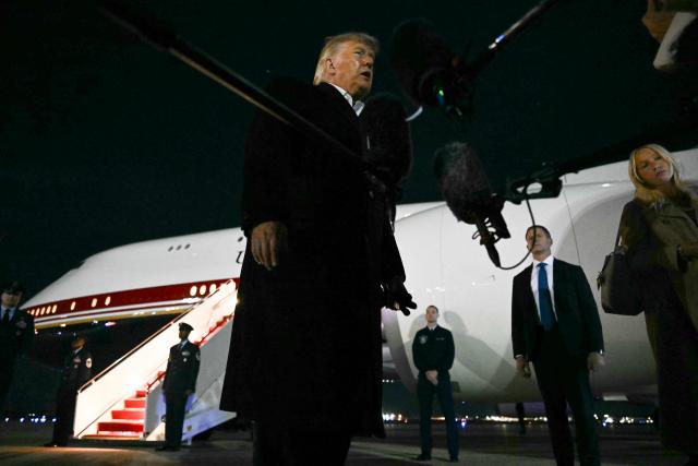 US President Donald Trump speaks to the media after disembarking from Air Force One at Joint Base Andrews, Maryland on October 26, 2026. President Trump is returning from Mississippi where he spoke at a midterm campaign rally. (Photo by Kent NISHIMURA / AFP)