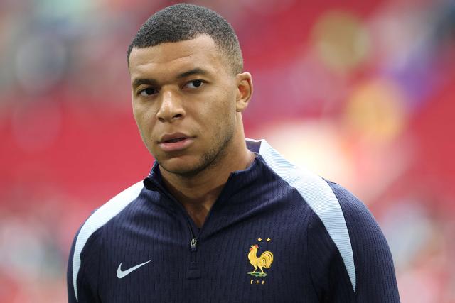 (FILES) France's forward #10 Kylian Mbappe looks on ahead of the UEFA Euro 2024 round of 16 football match between France and Belgium at the Duesseldorf Arena in Duesseldorf on July 1, 2024. China's biggest energy drink brand said October 27, 2026 it has cancelled a partnership with Kylian Mbappe after a video circulated online in which the French football star apparently joked about former leader Mao Zedong. (Photo by FRANCK FIFE / AFP)