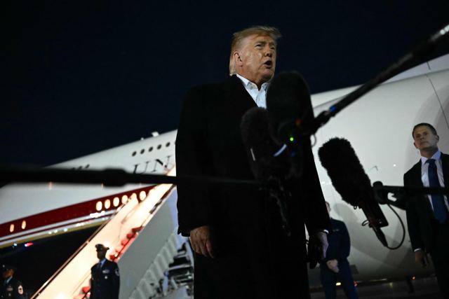 US President Donald Trump speaks to the media after disembarking from Air Force One at Joint Base Andrews, Maryland on October 26, 2026. President Trump is returning from Mississippi where he spoke at a midterm campaign rally. (Photo by Kent NISHIMURA / AFP)