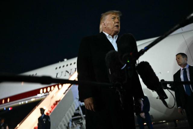 US President Donald Trump speaks to the media after disembarking from Air Force One at Joint Base Andrews, Maryland on October 26, 2026. President Trump is returning from Mississippi where he spoke at a midterm campaign rally. (Photo by Kent NISHIMURA / AFP)