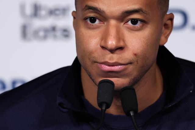 (FILES) France's forward Kylian Mbappe looks on during a press conference at the Parc des Princes stadium, in Paris, on November 12, 2025 on the eve of the FIFA World Cup 2026 Group D European qualification football match against Ukraine. China's biggest energy drink brand said October 27, 2026 it has cancelled a partnership with Kylian Mbappe after a video circulated online in which the French football star apparently joked about former leader Mao Zedong. (Photo by Franck FIFE / AFP)