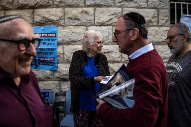Voters wait in line at a polling station in Jerusalem on October 27, 2026, on the day of Israel's legislative election. A deeply divided Israel heads to the polls on October 27 for the first time since Hamas's October 7, 2023 attack, with voters delivering their verdict on veteran Prime Minister Benjamin Netanyahu and the country's rightward drift. (Photo by John WESSELS / AFP)