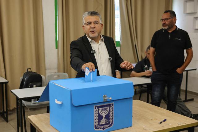 Yousef Jabareen, leader of Israel's Arab-led Joint List political alliance, casts his ballot to vote at a polling station in the Arab-Israeli town of Umm al-Fahm on October 27, 2026, on the day of Israel's legislative election. Israelis began voting on October 27 in the first general election since Hamas's October 7, 2023 attack, with voters to deliver their verdict on Prime Minister Benjamin Netanyahu and the country's rightward drift. (Photo by AHMAD GHARABLI / AFP)