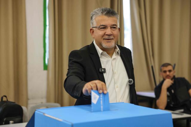Yousef Jabareen, leader of Israel's Arab-led Joint List political alliance, casts his ballot to vote at a polling station in the Arab-Israeli town of Umm al-Fahm on October 27, 2026, on the day of Israel's legislative election. Israelis began voting on October 27 in the first general election since Hamas's October 7, 2023 attack, with voters to deliver their verdict on Prime Minister Benjamin Netanyahu and the country's rightward drift. (Photo by AHMAD GHARABLI / AFP)