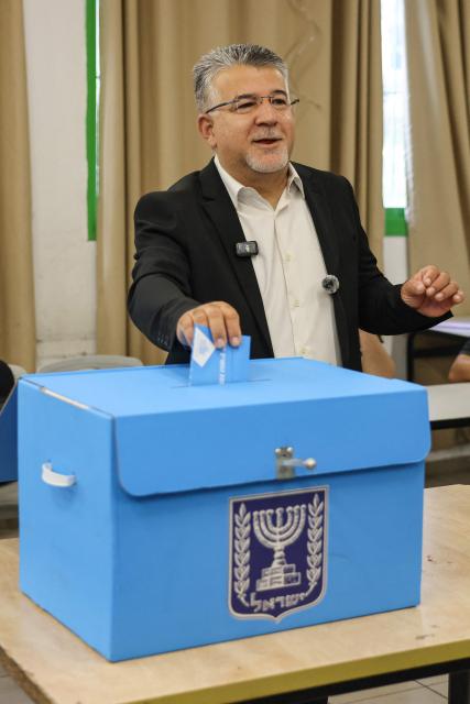 Yousef Jabareen, leader of Israel's Arab-led Joint List political alliance, casts his ballot to vote at a polling station in the Arab-Israeli town of Umm al-Fahm on October 27, 2026, on the day of Israel's legislative election. Israelis began voting on October 27 in the first general election since Hamas's October 7, 2023 attack, with voters to deliver their verdict on Prime Minister Benjamin Netanyahu and the country's rightward drift. (Photo by AHMAD GHARABLI / AFP)